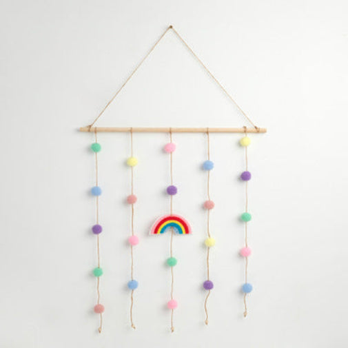 Guirlande de pompons couleur macaron pour décorer la chambre de filles