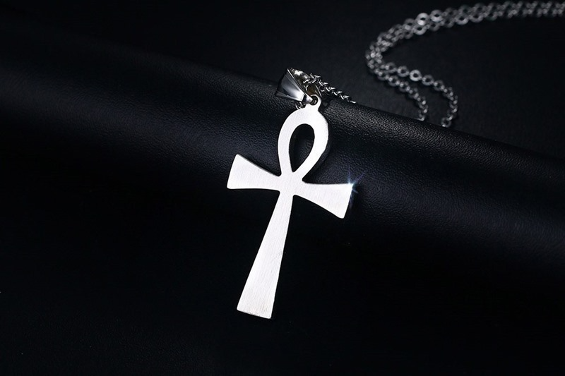 Collier avec pendentif croix en or et acier